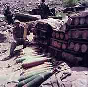 Soldiers taking care of weapons